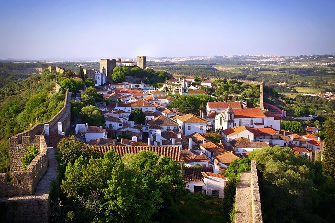 2-Day Sacred Portugal Trip: Fátima, Batalha, Nazaré and Óbidos, from Lisbon - Óbidos: Medieval Walls, a Guided Walk, and What to Listen For