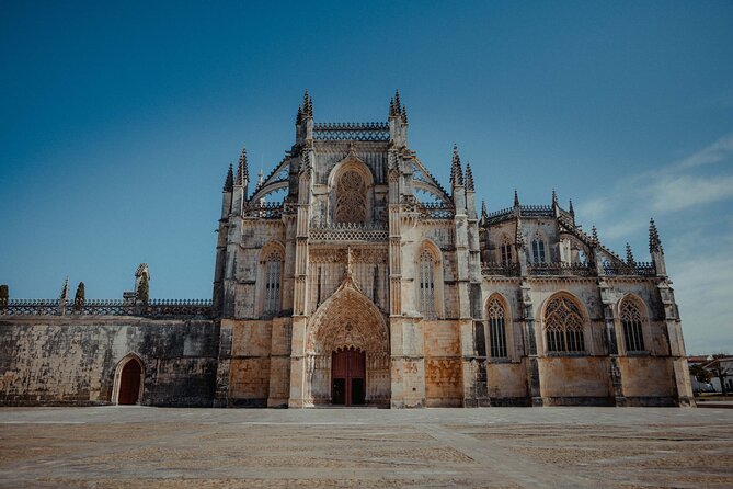 Best Fátima, Óbidos, Nazaré & Batalha Tour From Lisbon - Óbidos: medieval walls, narrow lanes, and ginjinha in a chocolate cup