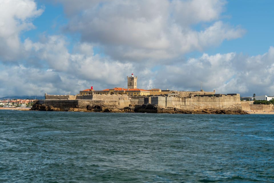 Boat tour: charming Cascais Coast to Lisbon lighthouse - Estoril pass-by views: quick hits of beach and beachfront forts