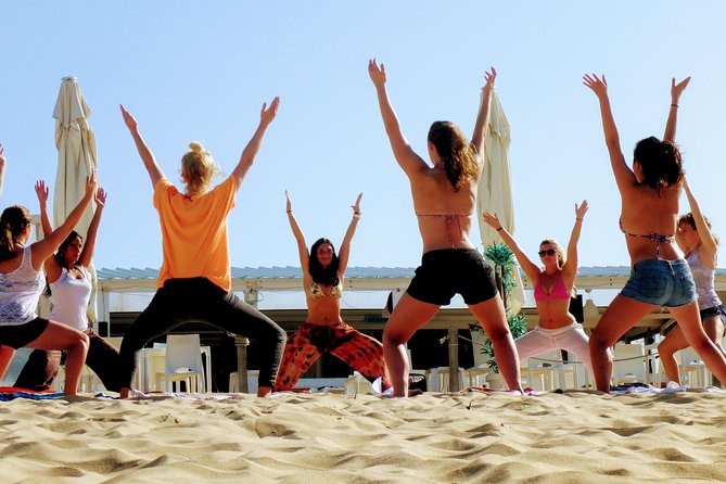 Costa da Caparica Surf and Yoga from Lisbon - Beach yoga in the morning mold: relaxation you can actually feel
