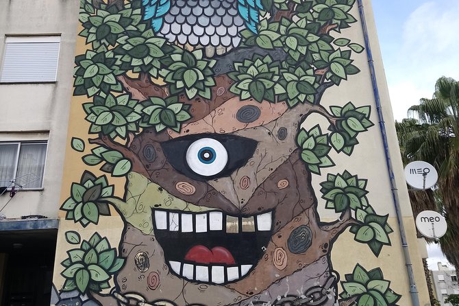 Discover Lisbon's Best Street Art - Eduardo Kobra and Newer Lisbon Hotspots: The Guinness Wall Effect