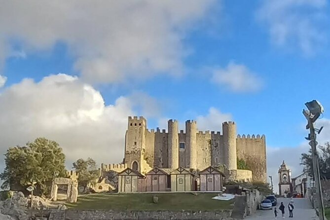 Fatima- Nazare-Obidos private tour from Lisbon or Cascais - Stop 3: Óbidos Castle streets, ginginha, and the walls walk