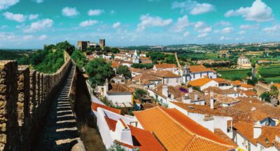 From Lisbon: Nazare Big Waves and Óbidos Guide Day Trip - The 8-hour rhythm: timing, van ride, and meeting points