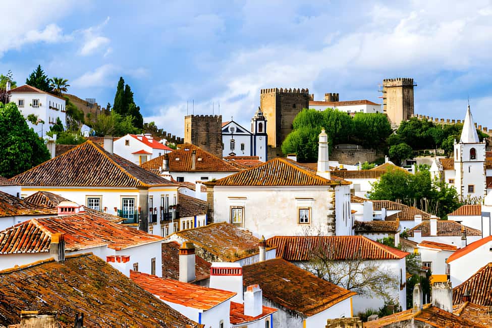 From Lisbon: Obidos, Nazaré and Fátima Small Group Tour - A 9-hour blend of medieval, surf, and pilgrimage
