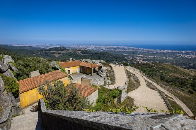 From Lisbon: Sintra, Pena Palace and Regaleira - Quinta da Regaleira: wells, tunnels, and a guided maze of meaning