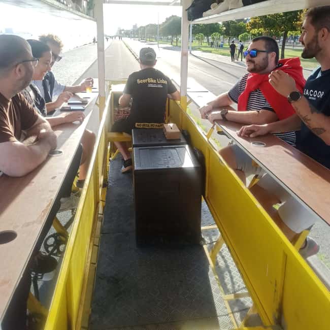 Lisbon: 1-Hour Beer or Sangria Bike Sightseeing Tour - Entering the yellow Beer Bike scene near Av. da Índia