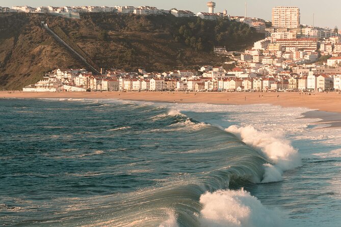 Lisbon: 8h Tour to Nazaré, Óbidos & Alcobaça (Church Incl.) - Óbidos: a guided medieval walk plus snack and drink time