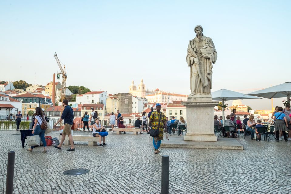 Lisbon by Tuk Tuk Guided Tour: City of Neighborhoods - Feira da Ladra: a live slice of Lisbon street life