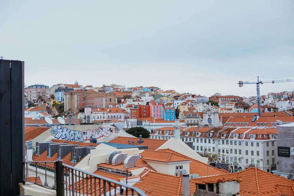 Lisbon: Evening Food & Wine Tour in Bairro Alto - Grapes & Bites / Hostel and Wines: wine-forward tastings that set the mood