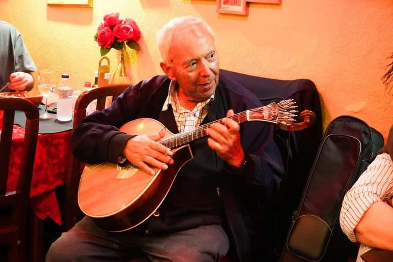 Lisbon: Fado Musical Experience with Portuguese Appetizers - Inside the local restaurant: appetizers, seating, and the sound