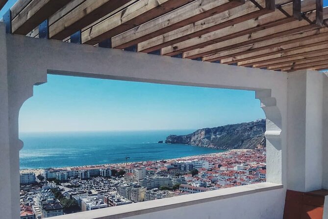 Lisbon: Fátima, Nazaré and Óbidos Full-Day Guided Tour - Stop 5–6: Nazaré and Praia do Norte—coastal beauty with wave reality checks