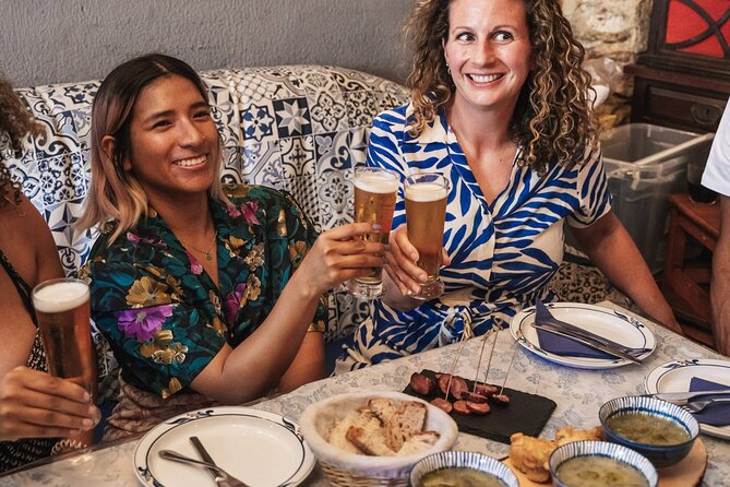 Lisbon Flavours: Baixa Guided Food Tour with Portuguese Wine - Stop 3: Rua da Vitória for sardines, seafood rice, and Vinho Verde