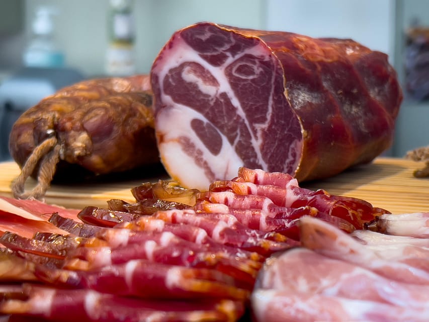Lisbon : Food & Fado Tour - Stop 1: A Portuguese delicatessen with wine pairings