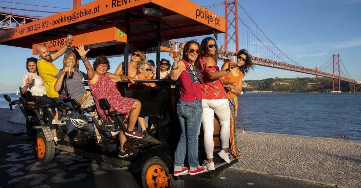 Lisbon: Fun Beer Bike by the Seafront - Under the 25 de Abril Bridge: a photo stop that actually matters