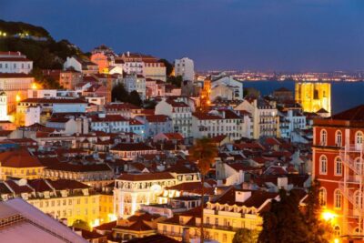 Lisbon: Half-Day Night Group Tour w/ Fado Dinner Show - Getting oriented fast: Marques de Pombal, Rossio, Baixa Pombalina, and the city grid