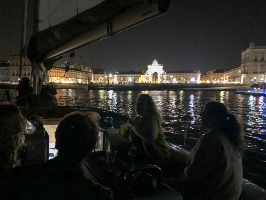 Lisbon: Luxury Sailboat Cruise at Night - The bridge moment and central Lisbon from the waterline