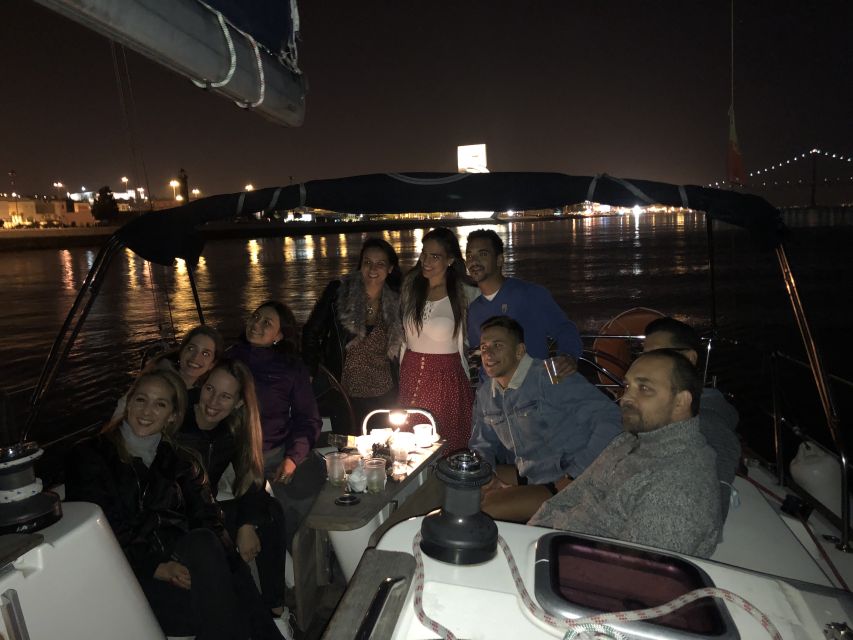 Lisbon: Luxury Sailboat Cruise at Night - Alfama and the Christ the King view corridor