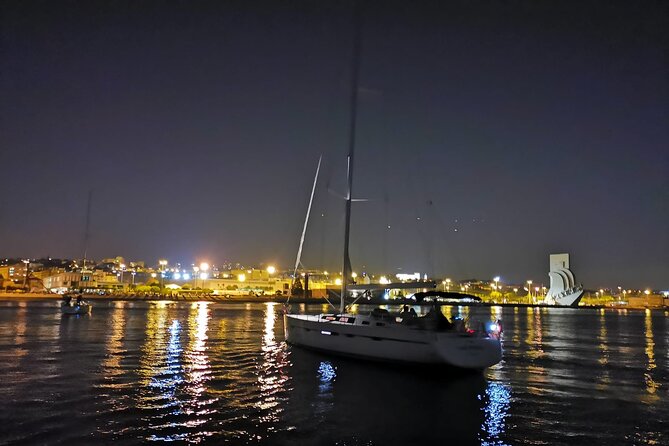 Lisbon Night Sailing Tour with a Drink- 2h Small Group Tour - Belém lit up: Discoveries monument, Belém Tower, and more