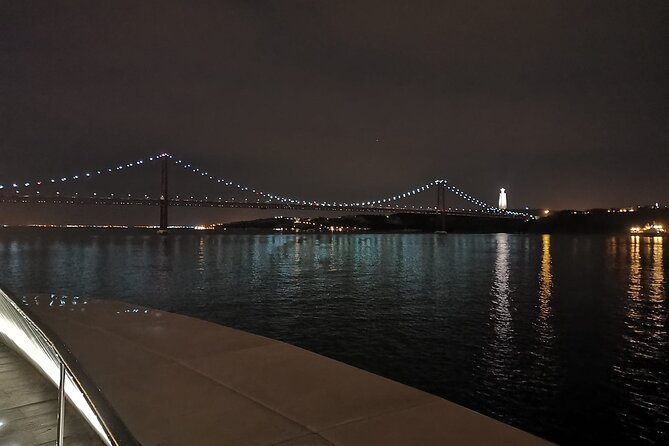 Lisbon Night Sailing Tour with a Drink- 2h Small Group Tour - Crossing toward Cacilhas and ending near Christ the King’s glow