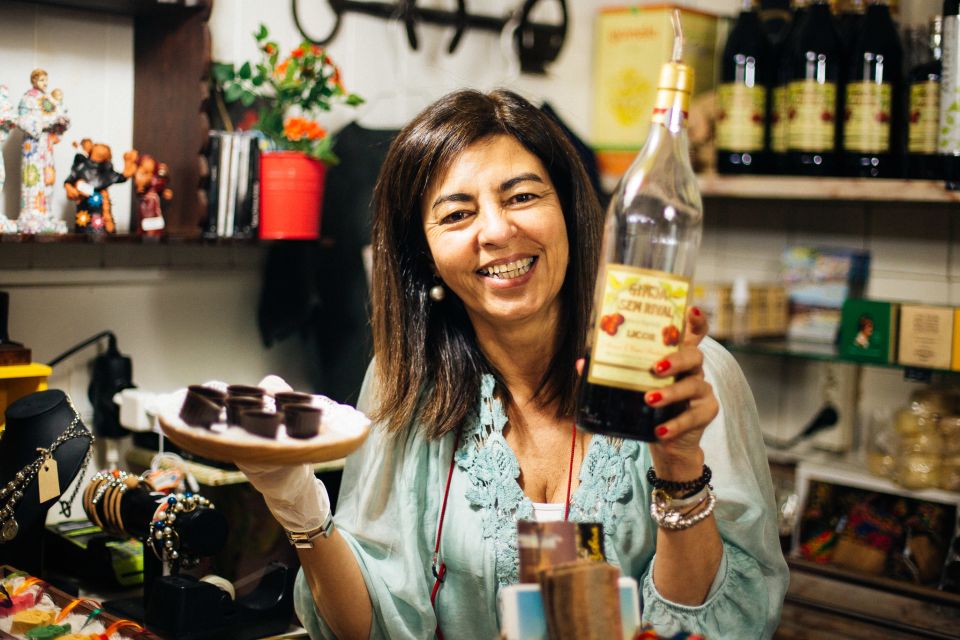 Lisbon: Private Evening Tour with Drinks & Bites in Alfama - Local bites to watch for: Salada de Bacalhau and Ginjinha