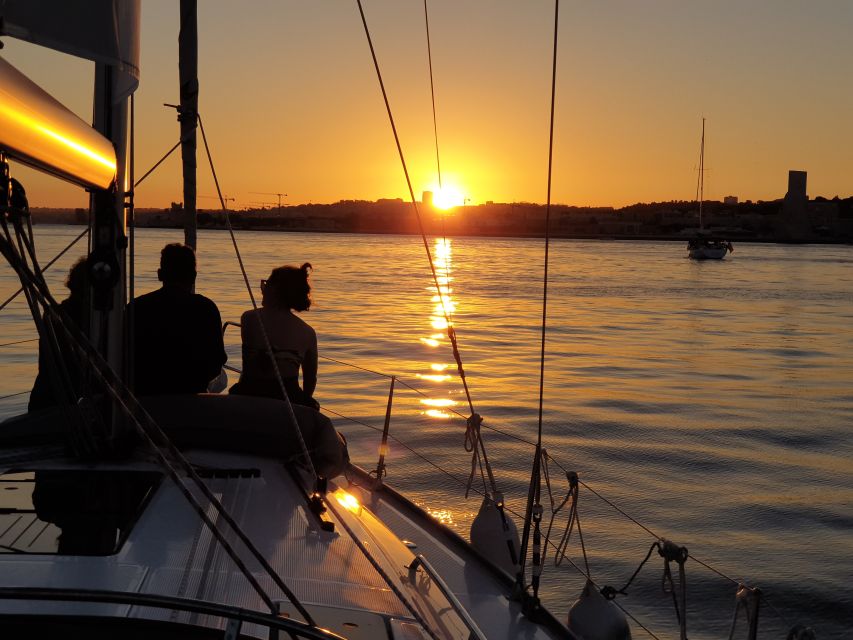 Lisbon: Private Sunset Cruise with Portuguese Wine - Bridges and waterfront drama: 25 de Abril, Cais das Colunas, Praça do Comércio