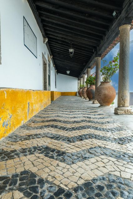 Lisbon: Private Transfer to Porto with stops until 3 cities - Óbidos for Medieval Streets and the Ginja Liqueur Stop