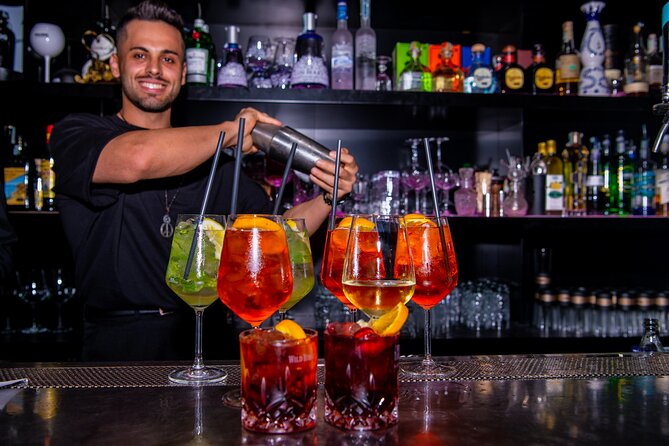 Lisbon Pub Crawl Walking Tour with Drinks Included - Largo do Carmo start: the Tipsy Tours sign and your first drink