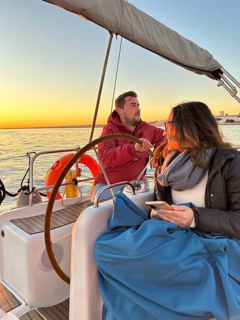 Lisbon: Romantic Cruise with Wine & Portuguese Tapas - 25 de Abril Bridge: the Lisbon icon you feel, not just see