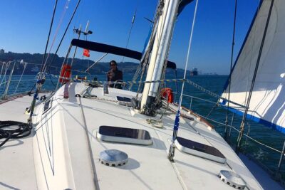 Lisbon Sailing Day Cruise with wine & snacks - The route view: 25 de Abril Bridge and Cristo Rei across the water