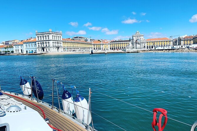 Lisbon Sailing Tour: 2-Hour Cultural Scenic Cruise with Wine - Praça do Comércio and the Cristo Rei view: Lisbon framed by water