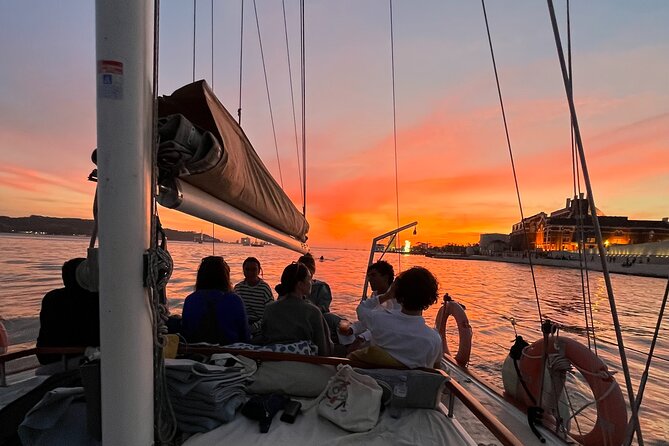 Lisbon Sunset Boat Cruise Tour With Drinks Included - The 25th April Bridge: built for connections, seen for drama