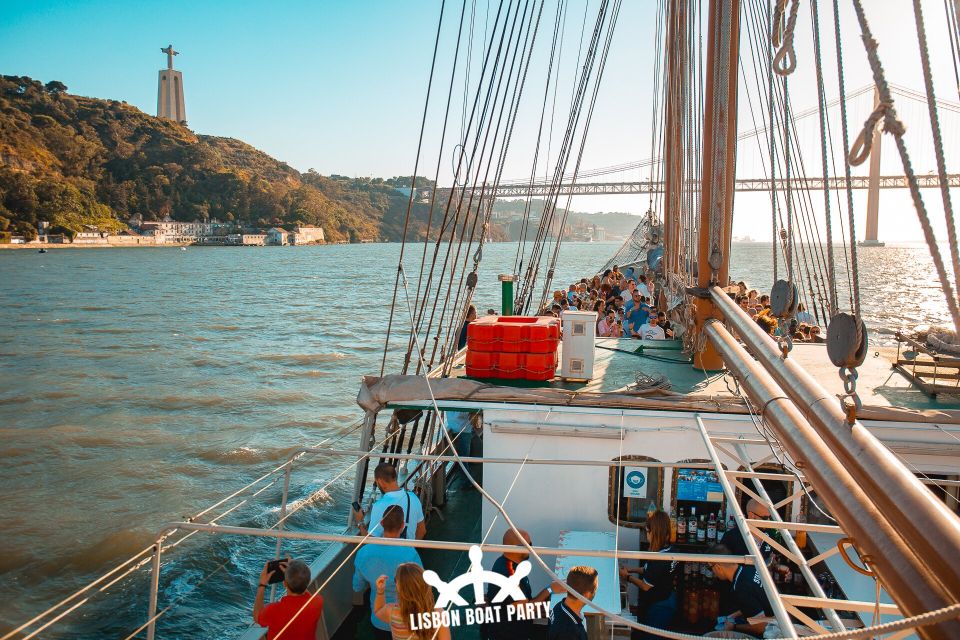 Lisbon: Sunset Boat Party with 2 Drinks and Free Club Entry - Christ the King Pass-By: The Sunset Framing Moment