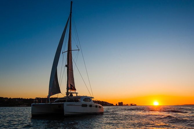 Lisbon: Sunset Cruise With Drinks on Spacious Yacht - Doca de Santo Amaro and the 25 de Abril Bridge view you’ll remember