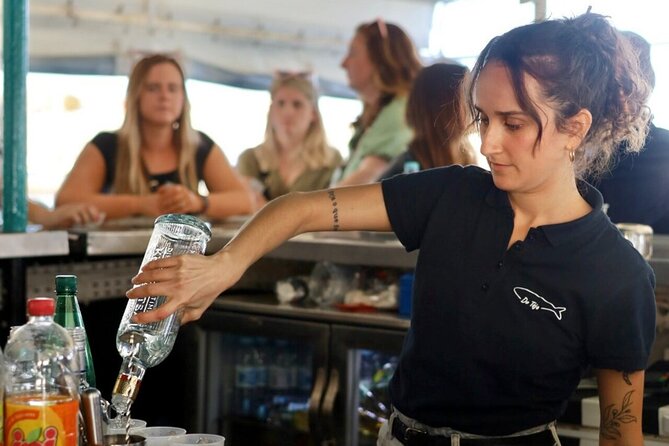 Lisbon: Sunset on board with music & drinks - Where You Meet the Boat at Cais Rocha Conde de Óbidos