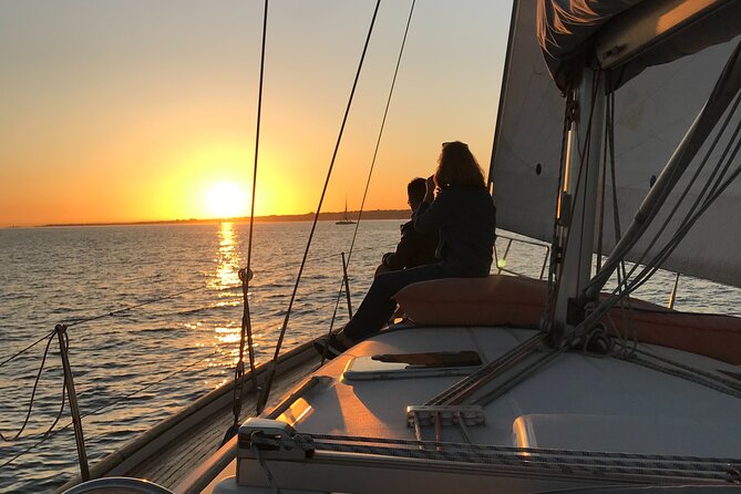 Lisbon Sunset Sailing Tour History & Local Wine — Small Group - What you’ll see during the 25th of April Bridge to Praça do Comércio arc