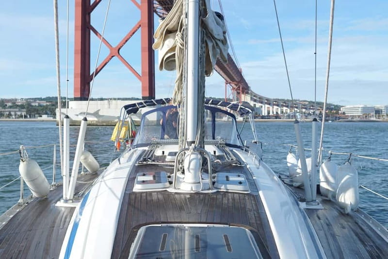 Lisbon: Sunset Sailing with Local Wine & Stunning Views - Gliding Past the 25 de Abril Bridge and Toward Belém