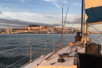 Lisbon Sunset Sensations on a Private Sailing Boat with wine&snacks - Sailing the 25 de Abril Bridge and the Cristo Rei panorama