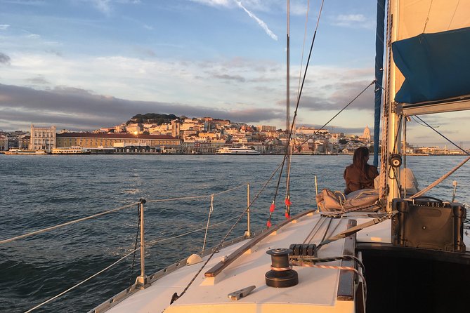 Lisbon Sunset Sensations on a Private Sailing Boat with wine&snacks - Sailing the 25 de Abril Bridge and the Cristo Rei panorama