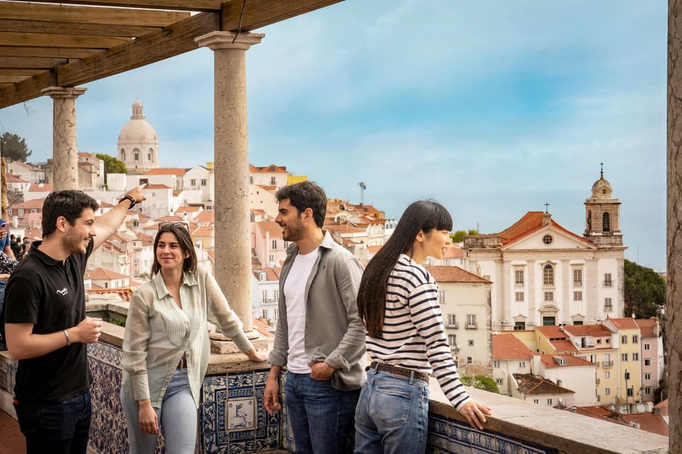 Lisbon: Walking Tour, Belém Neighborhood, Tram and Boat Ride - Walking Alfama: cathedral views and steep-street storytelling