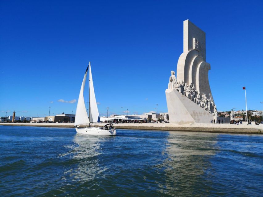 Lisbon: Yacht Sailing Tour With Portuguese Wine and History - 25 de Abril Bridge photo stop: engineering you can frame in one breath