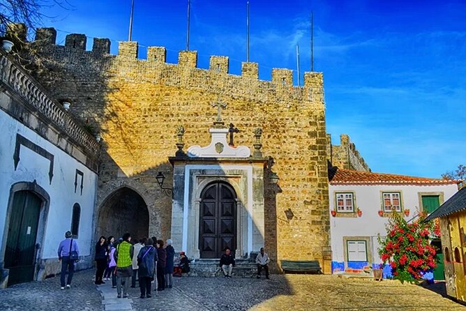 Private Lisbon to Fátima, Nazaré & Óbidos Tour – Spirit & Charm - Nazaré beach and Sitio views: sea drama plus real town energy