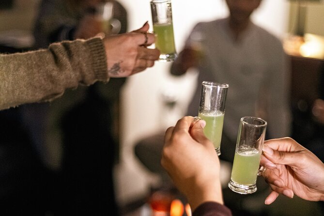Private Night Bar Crawl in Lisbon with Local Guide and Drinks - Largo do Carmo: The First Drink and the Darker Side of Lisbon