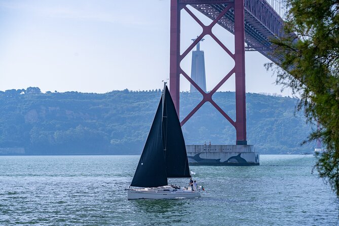 Private sailboat tour in Lisbon - Cristo Rei at the south bank: a signature statue view from the water