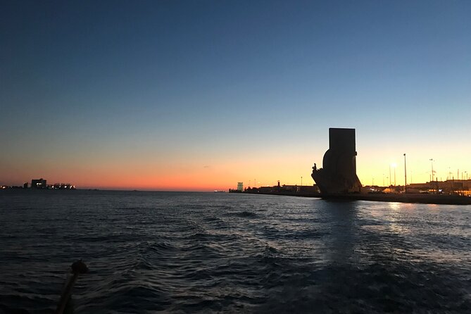 Romantic Sunset Sailing Experience in Lisbon - Praça do Comércio From the Water: Yellow Arches and Big-Scene Framing
