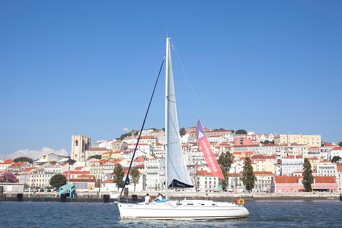 Small-Group Sailing Tour on the Tagus River from Lisbon - The drink, snacks, and the real vibe onboard