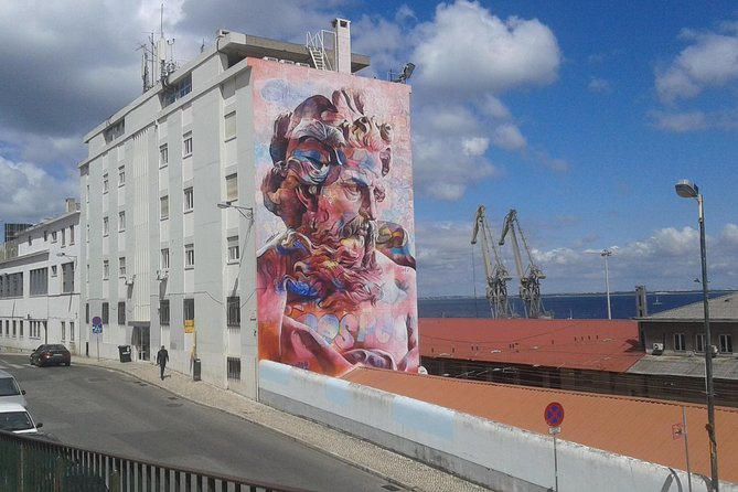 The Real Lisbon Street Art Private Guided Tour by Minivan - Lisbon Beyond the Usual Stops: Murals, Districts, and Minivan Power