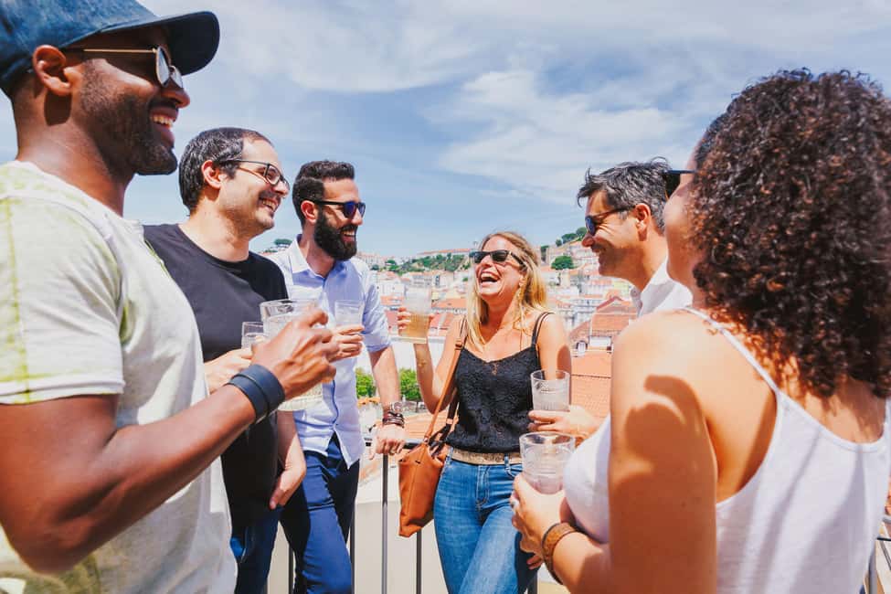 Total Lisbon Experience Walking Tour with Seafood Lunch - São Jorge Castle and the Tagus River approach: from streets to water views