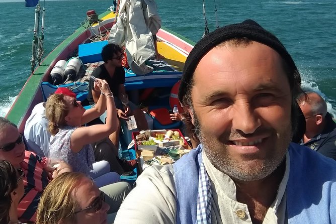 Traditional Lisbon Boat Experience - Exclusive - Past Tug Boats and Toward the Ocean: Christ the King and the 25 April Bridge