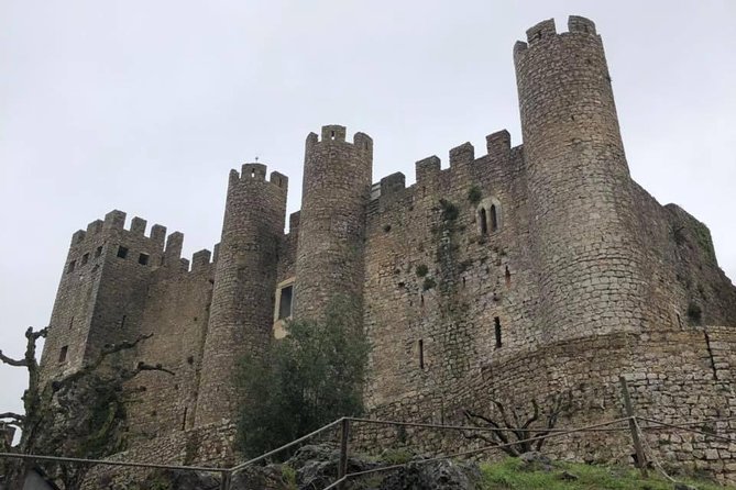 Transfer from Lisbon to Porto with visits on the way - Óbidos Medieval Walls and Ginjinha at the Right Time